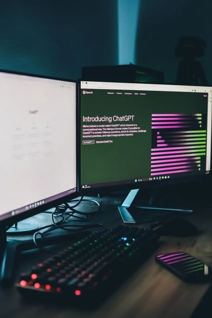 A modern computer screen displaying web design work, showcasing creative visuals in a workspace.